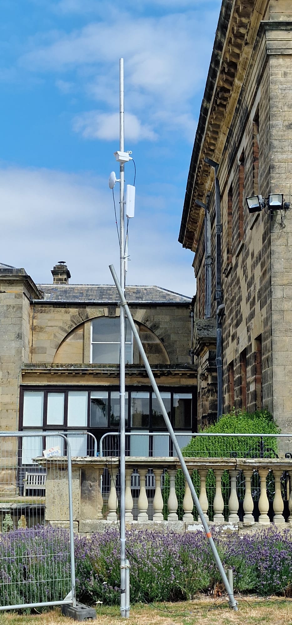 Communications mast installed against the estate building at Deershed