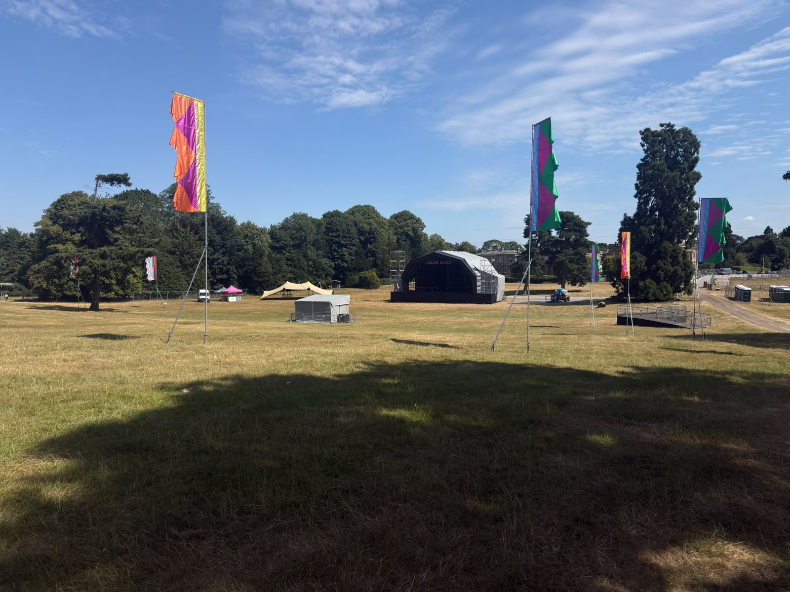 Deershed Festival site with stage and flags taking shape