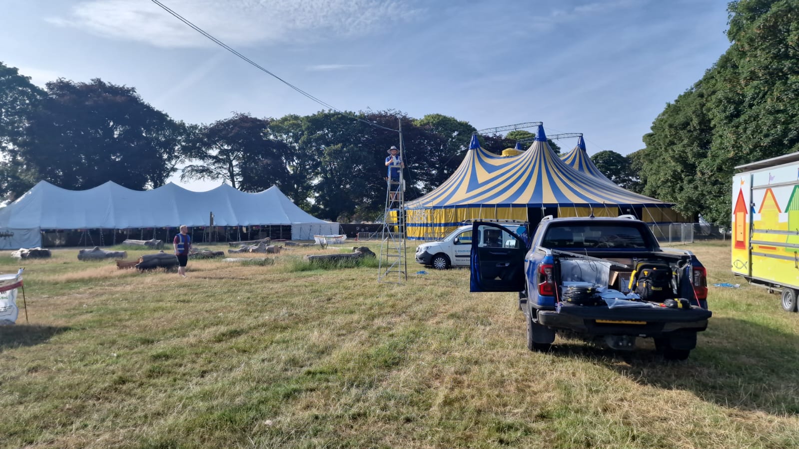 HTG team on site at Deershed Festival with the main big top behind during the arena build