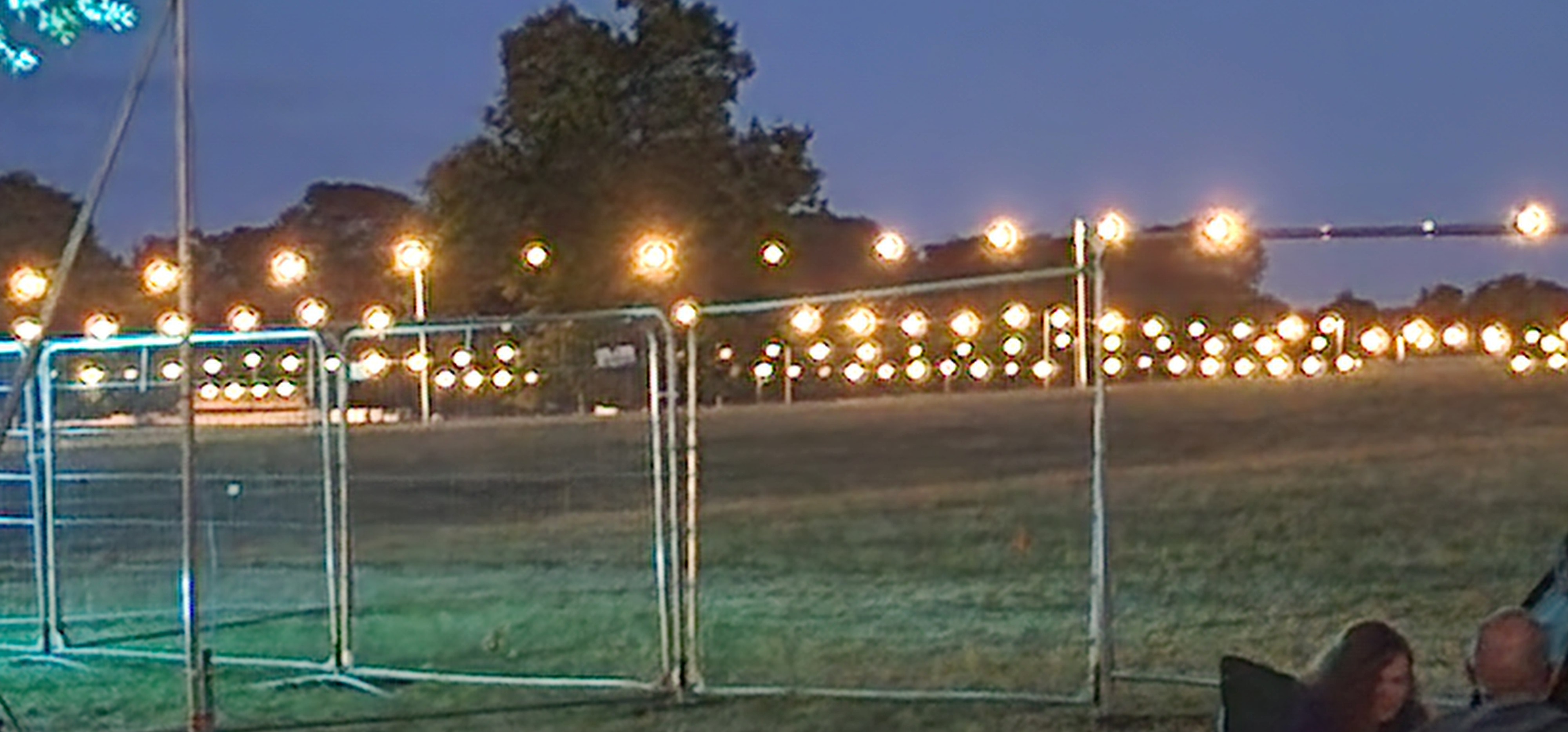 Site lighting across the Deershed festival field at dusk
