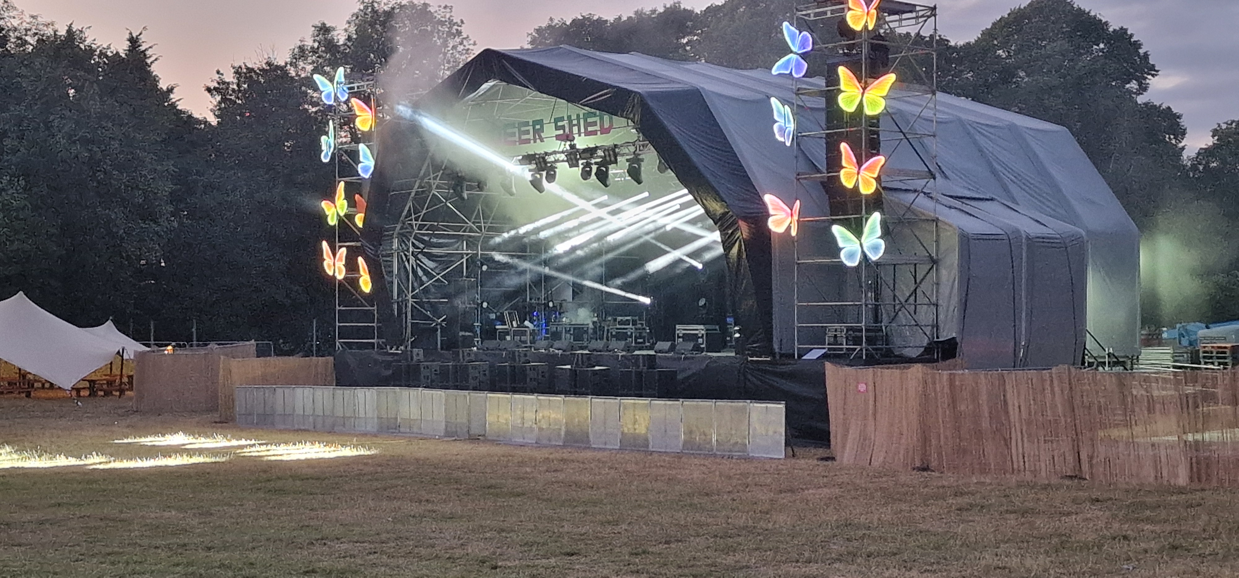 Deershed main stage with butterfly lighting rig fully illuminated during the evening pre-check
