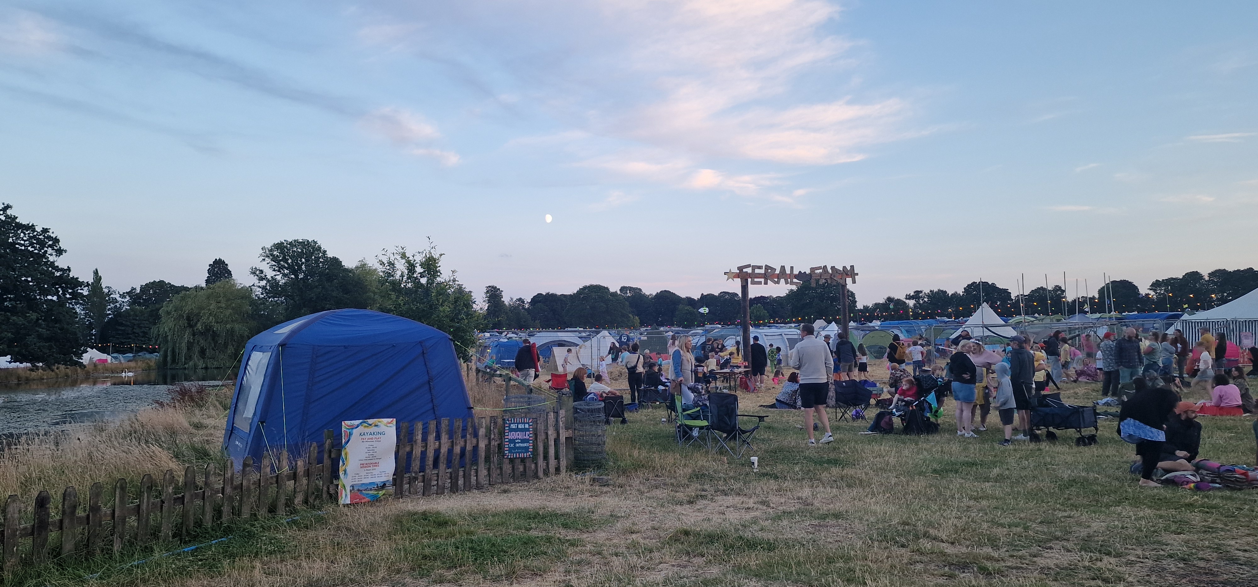 Deershed Festival 2026 Feral Farm with lake view and festival site at dusk